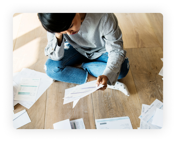 Penalties and Interest - Woman looking at papers